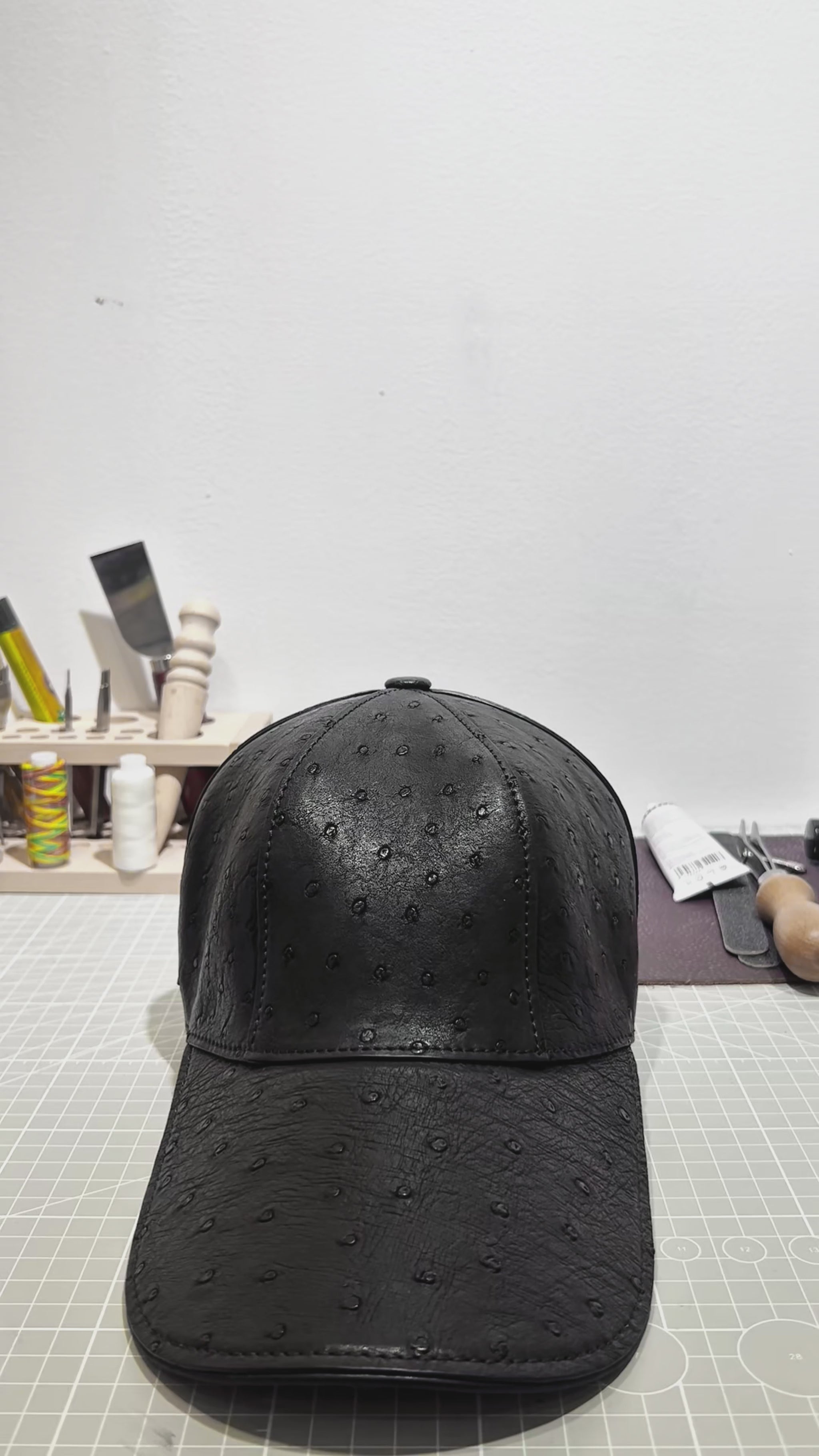 video demonstrating black genuine ostrich leather baseball cap
