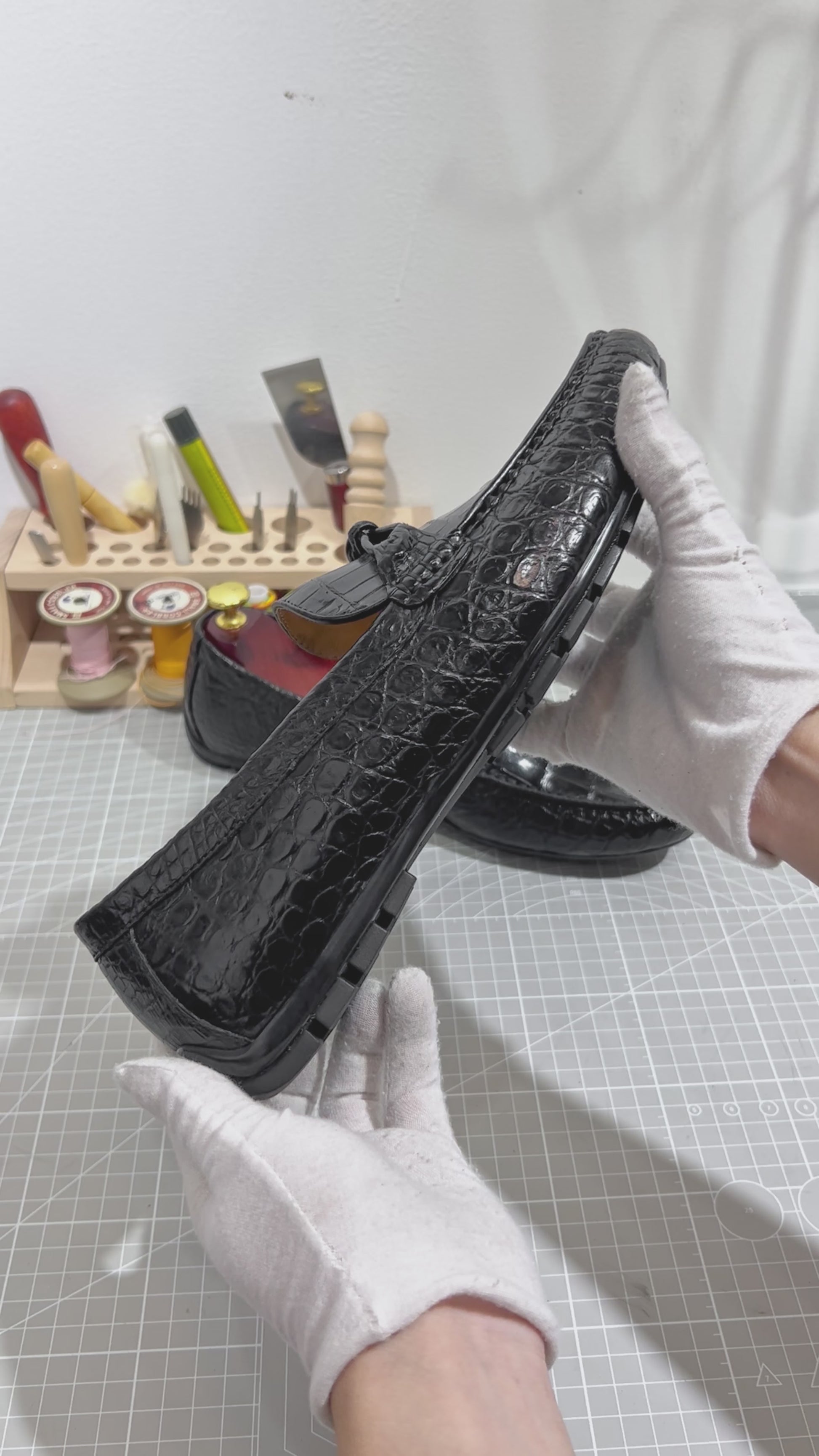 video demonstrating black genuine alligator belly leather knot loafers