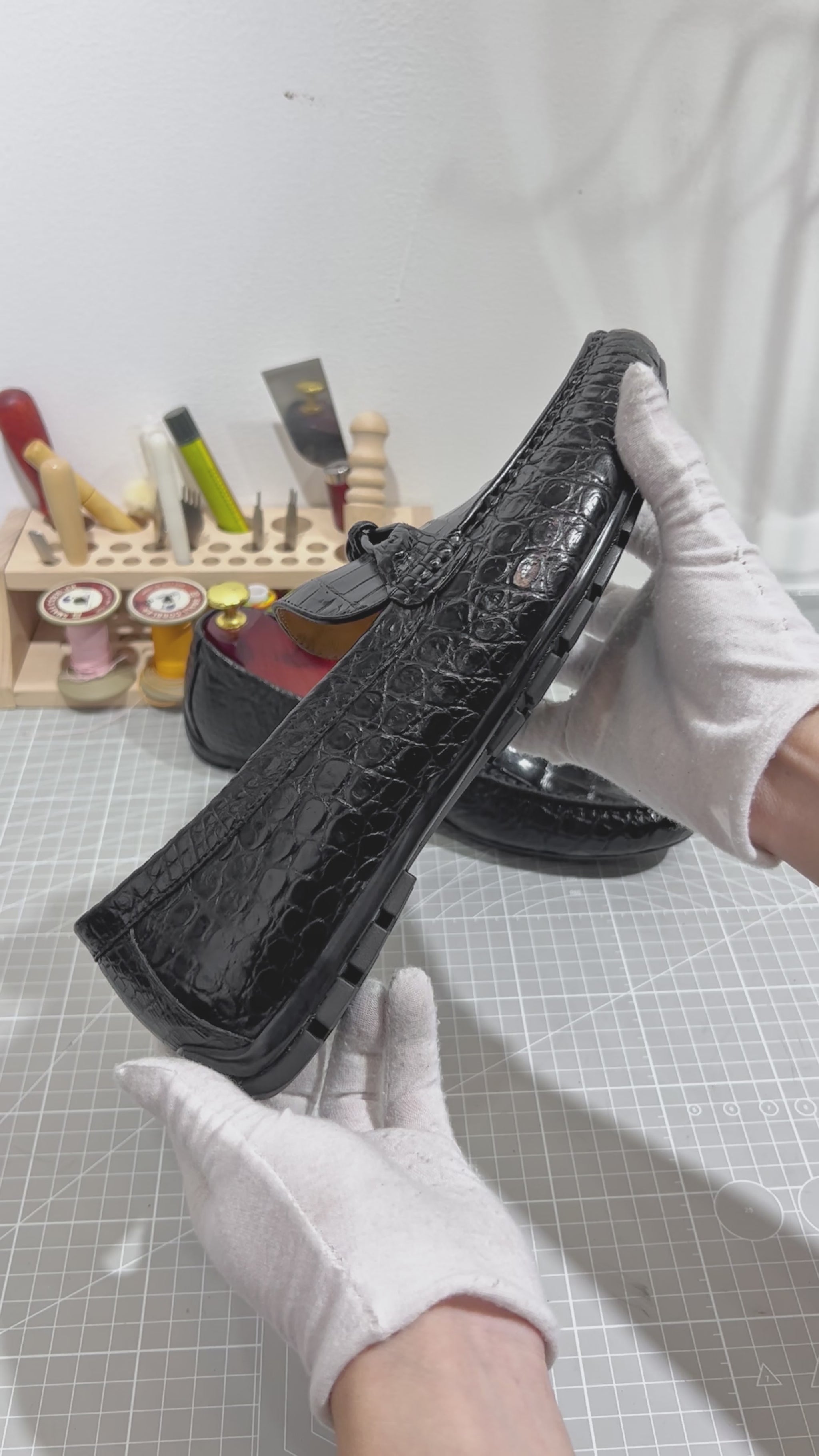 video demonstrating black genuine alligator belly leather knot loafers