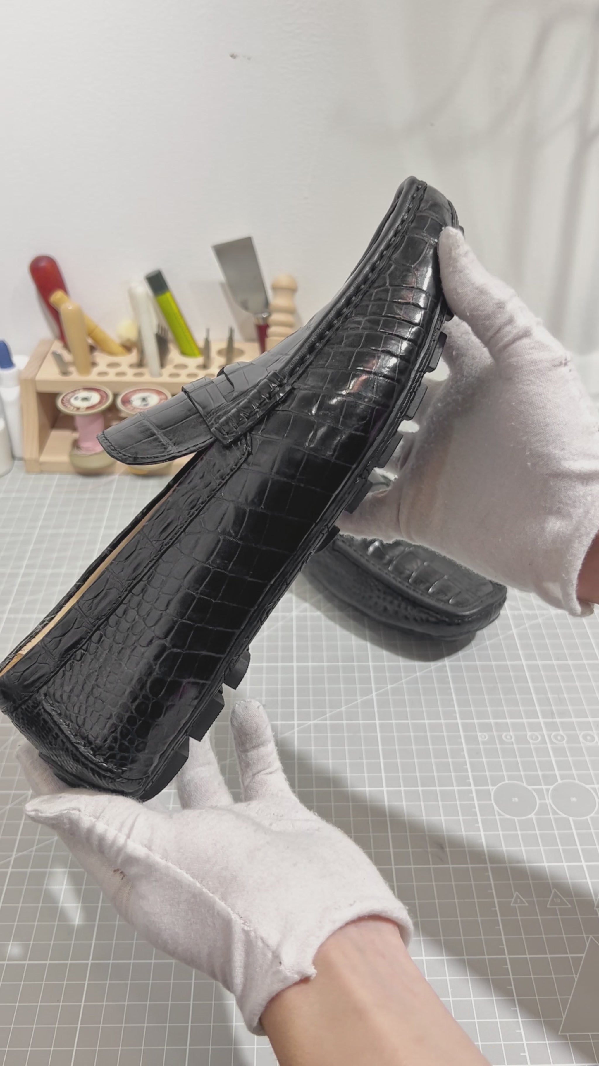 video demonstrating black genuine alligator belly leather penny loafers