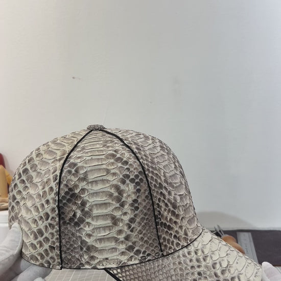 video demonstrating natural hue genuine python leather baseball cap