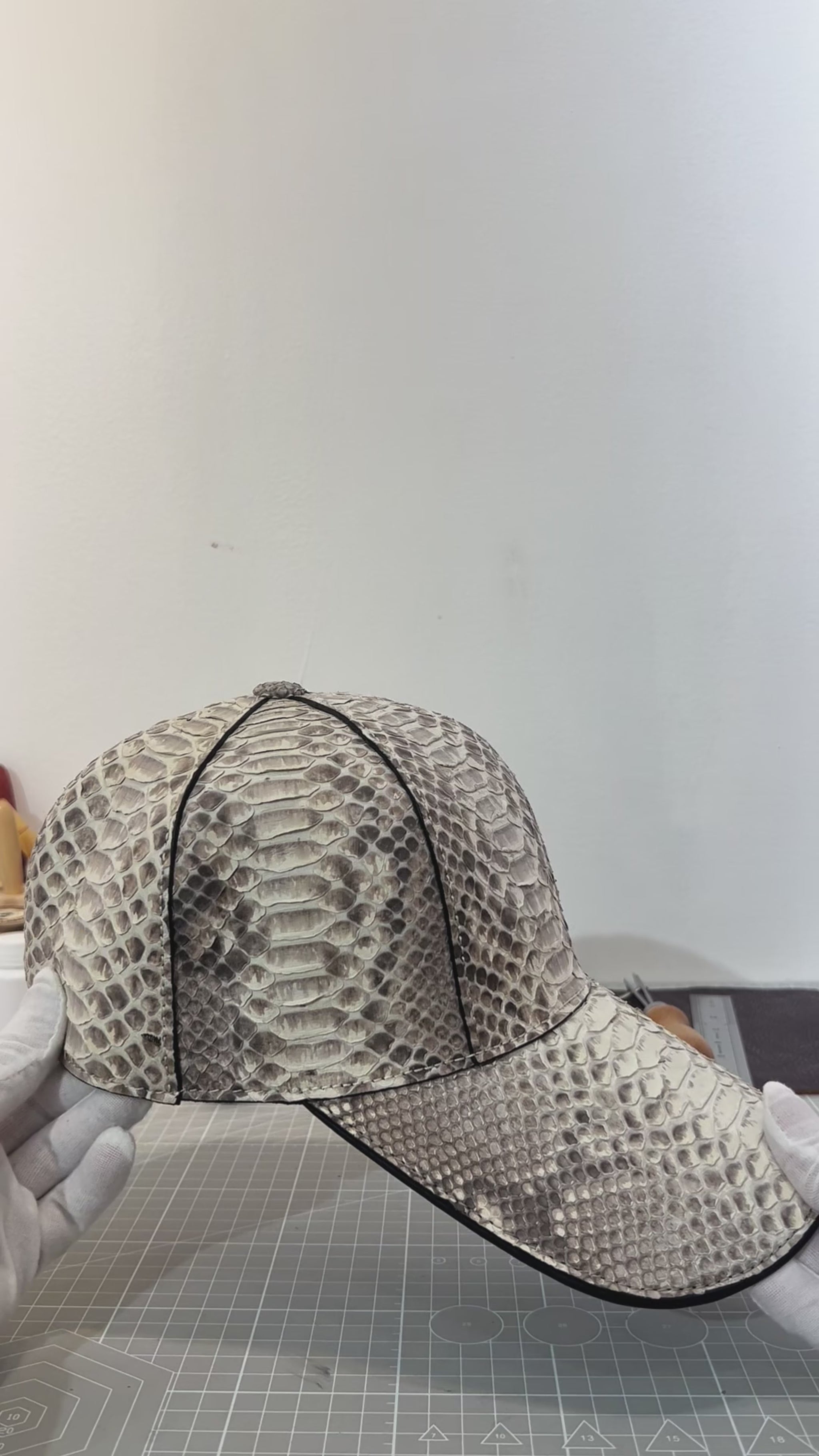video demonstrating natural hue genuine python leather baseball cap